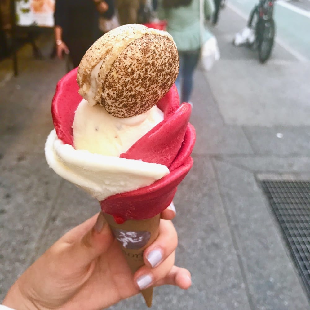 Tangy strawberry and vanilla gelato rose topped with a Macaroon from Amorino 