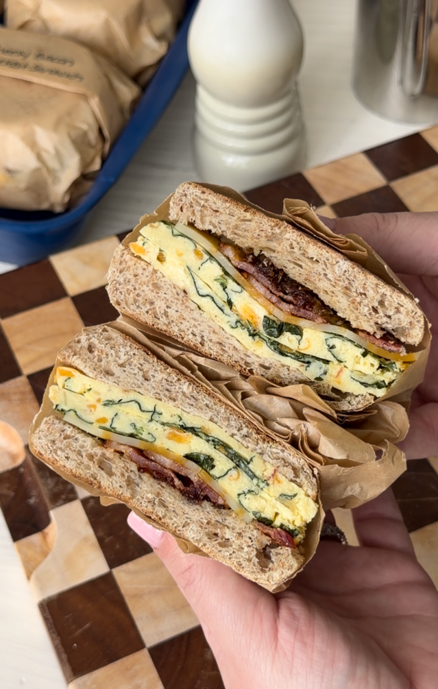 Loaded Breakfast Sandwiches with Sheet Pan Eggs, Crispy Bacon, & Caramelized Onions